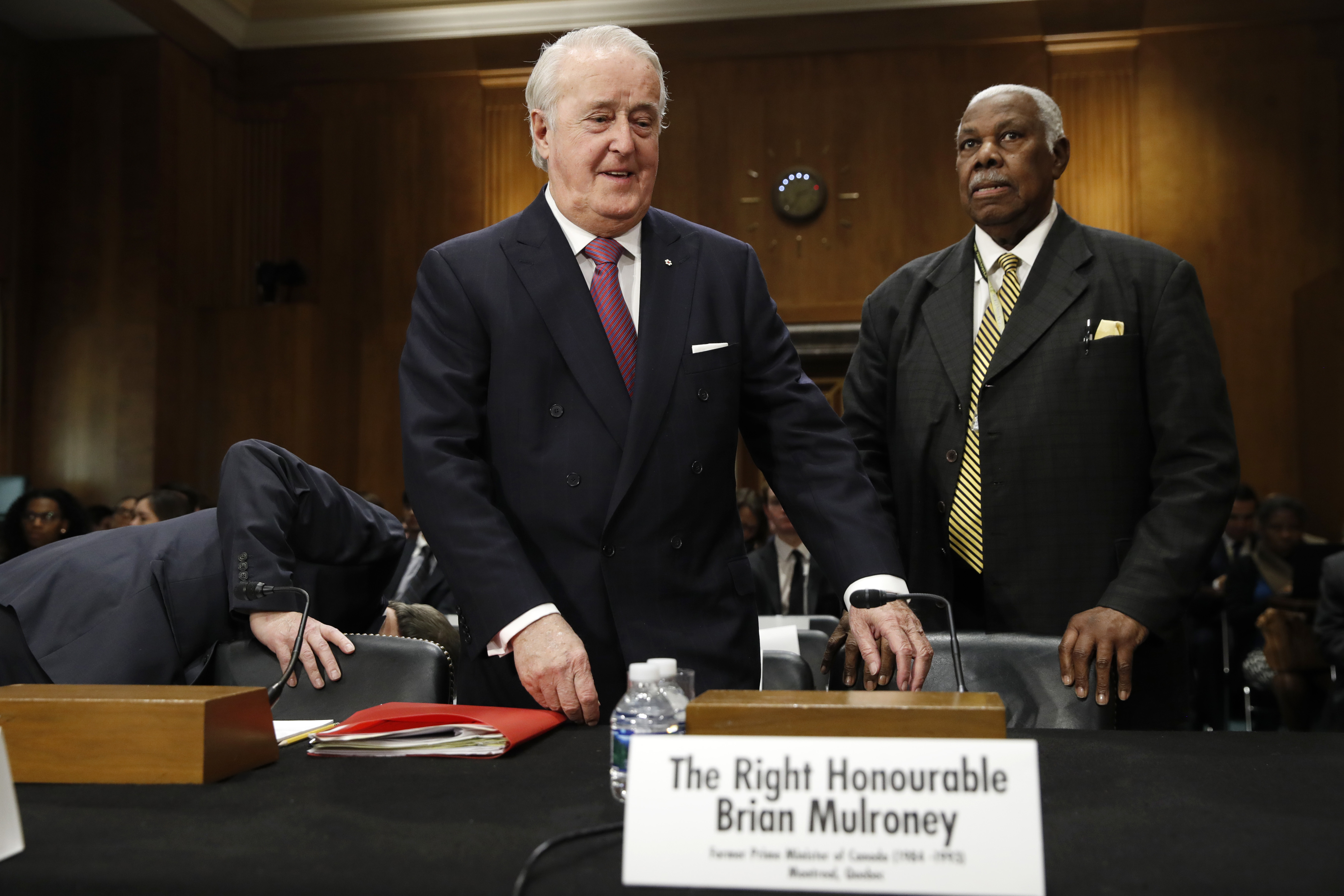 FILE - Brian Mulroney, the former prime minister of Canada, center, takes his seat for a Senate Foreign Relations Committee hearing on the Canada-U.S.-Mexico relationship, Tuesday, Jan. 30, 2018, on Capitol Hill in Washington. Mulroney has died at the age of 84, his daughter Caroline Mulroney posted on social media, Thursday, Feb. 29, 2024. (AP Photo/Jacquelyn Martin, File)