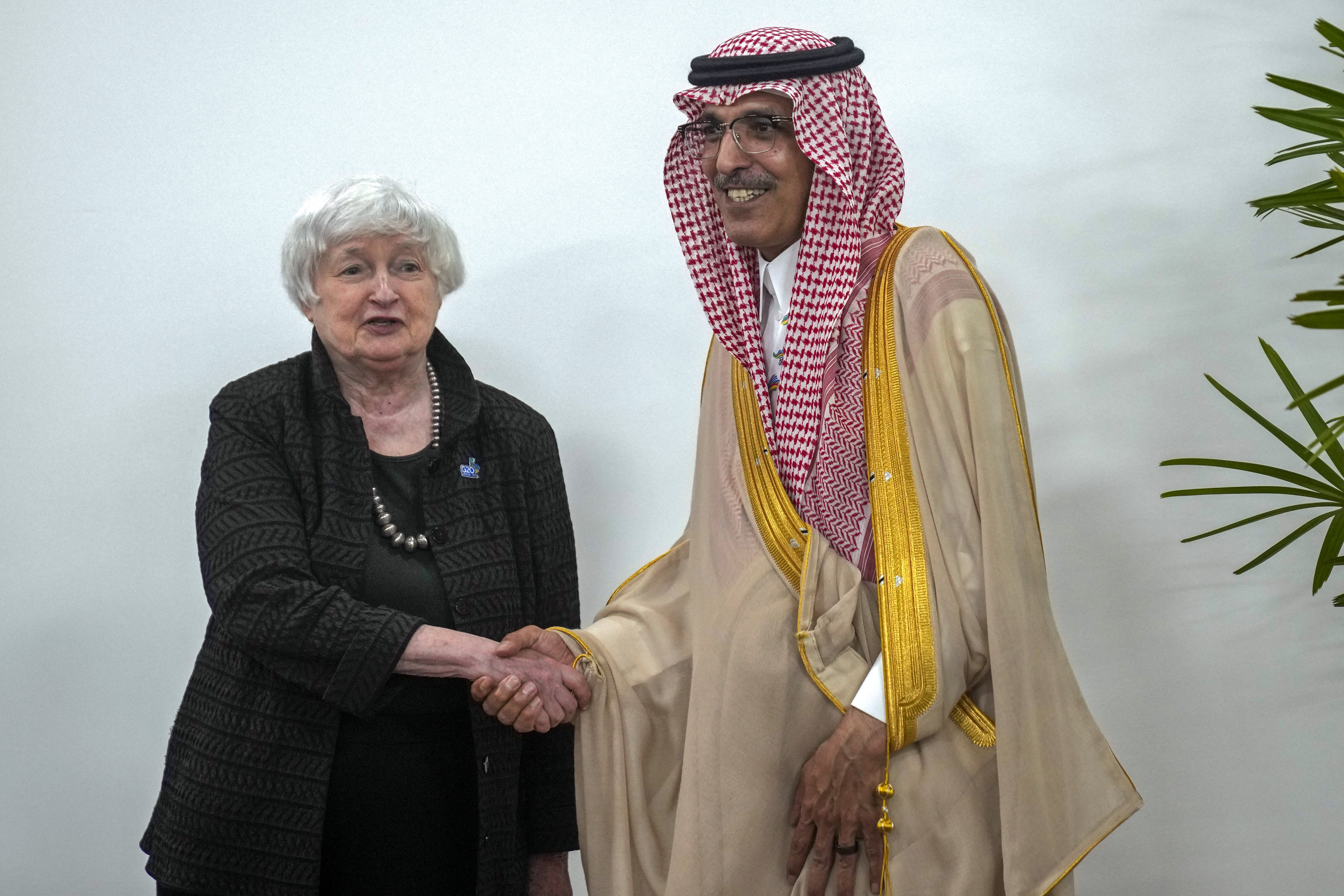 U.S. Secretary of the Treasury Janet L. Yellen, left, shakes hands with Saudi Arabia's Finance Minister Mohammed al-Jadaan before their bilateral meeting at the G20 Finance Ministers and Central Bank Governors meeting in Sao Paulo, Brazil, Thursday, Feb. 29, 2024. (AP Photo/Andre Penner)